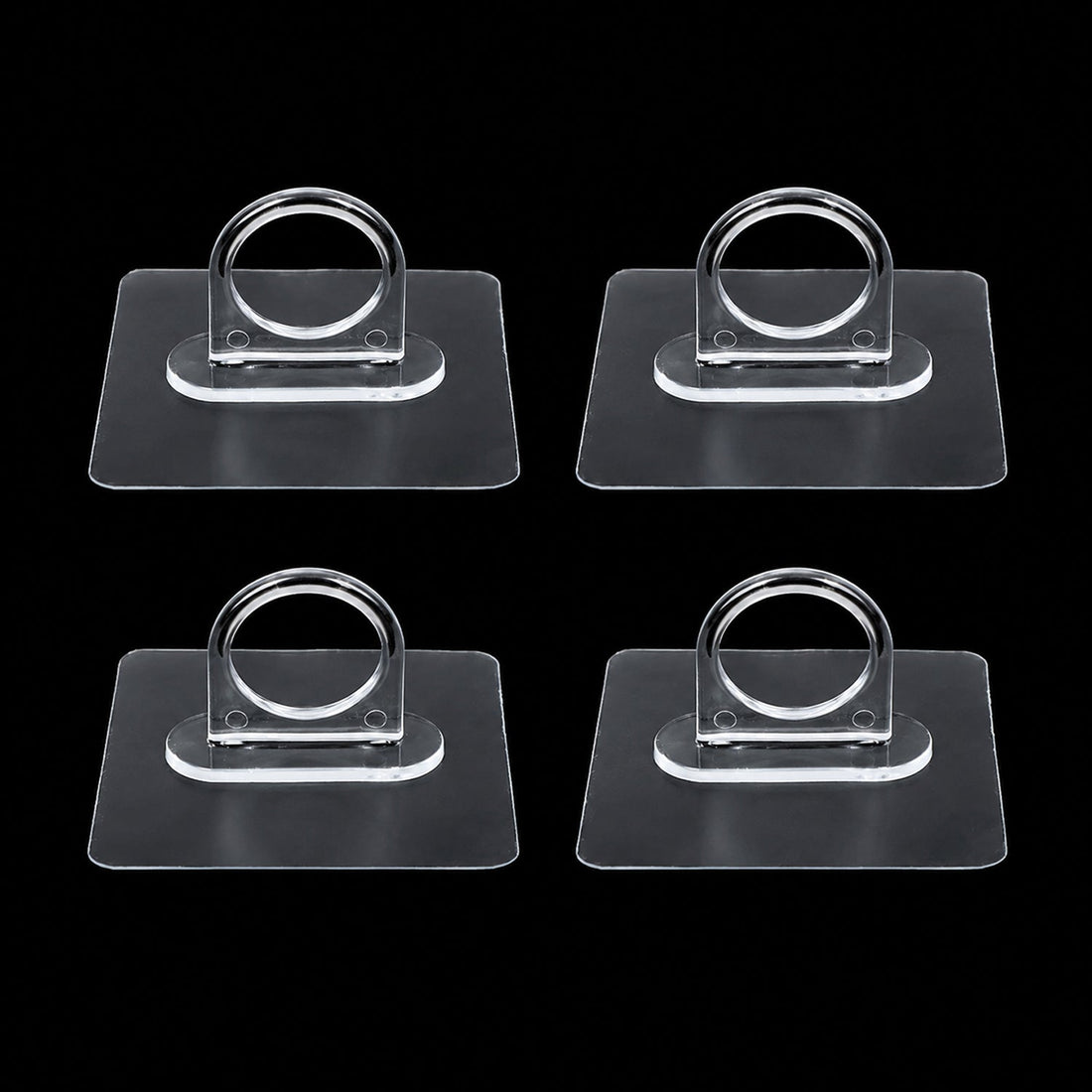 Adhesive plastic wall hook 4-piece set mounted on wall for home organisation