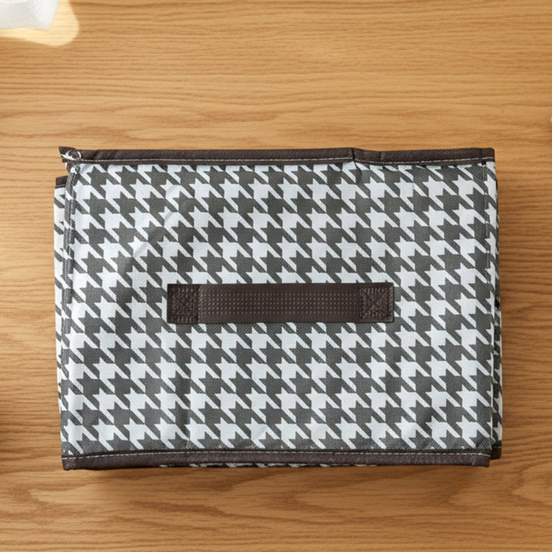 Foldable fabric storage basket in flat position