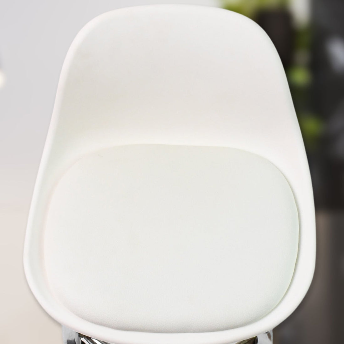 Detailed view of the heavy-duty steel base and durable construction of the rolling stool.
