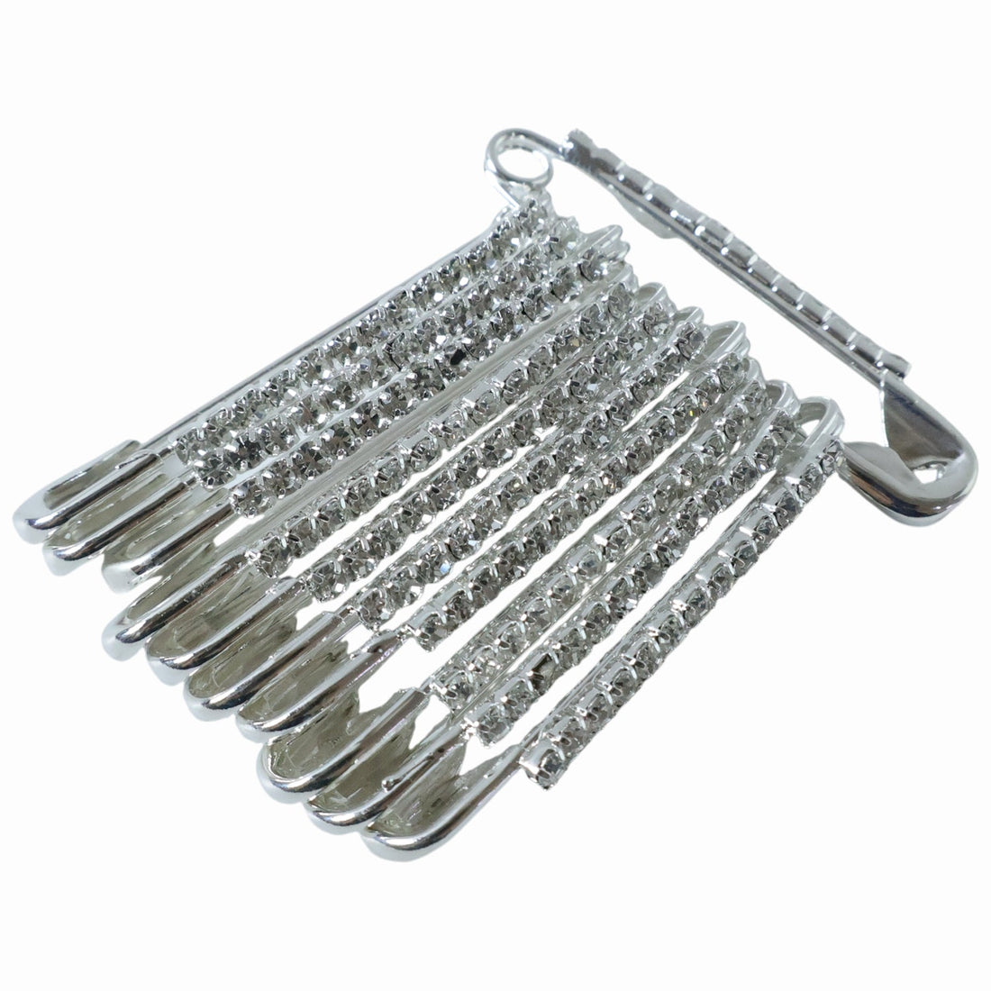 Multiple silver safety pins from the 12-piece decorative brooch set