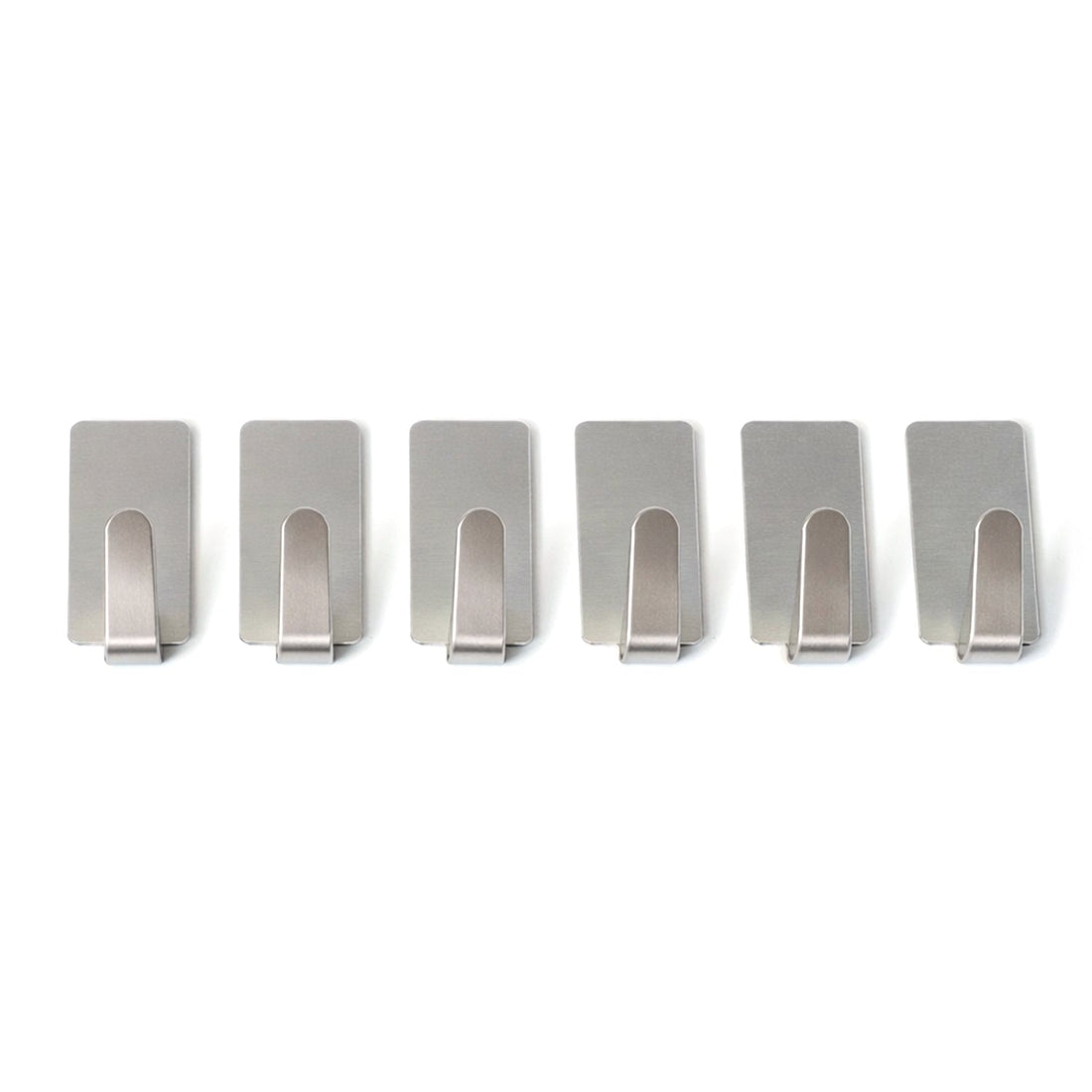 Wall hooks hanging keys and towels in home setting