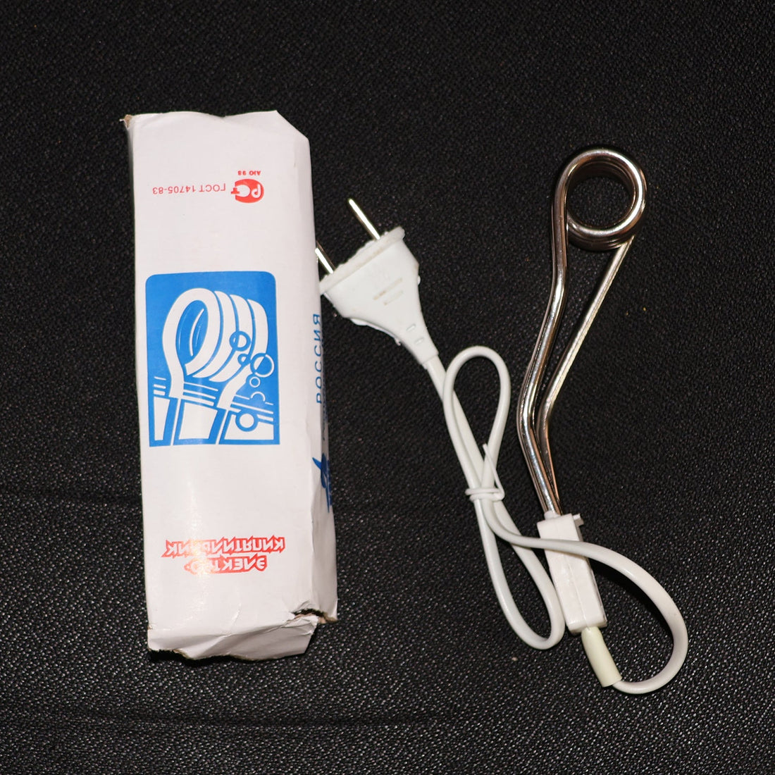 Fast heating immersion rod being used to quickly warm water for a bath