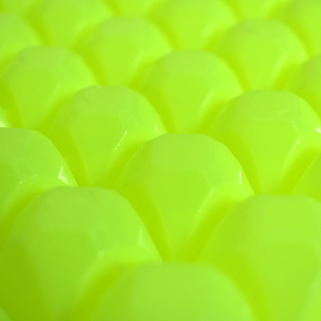 A stream of water filling the easy release ice tray cavities.