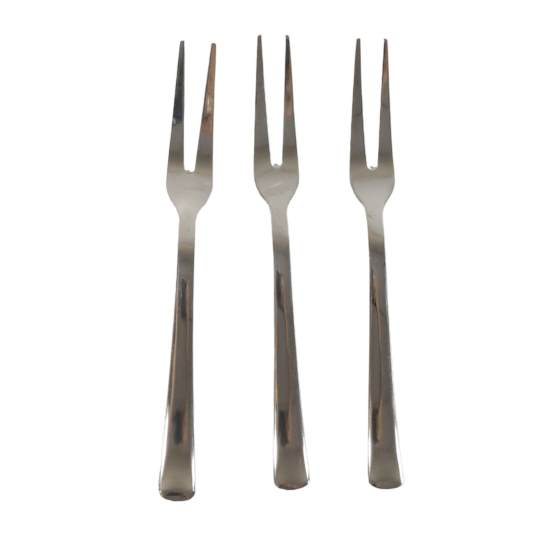 Three small appetizer forks laid out for serving snacks