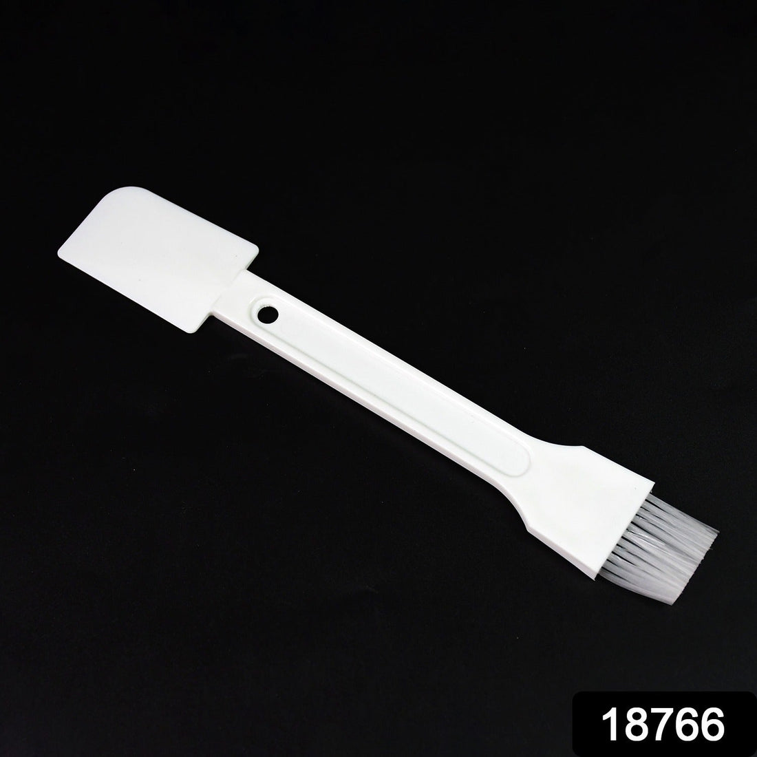 Small dust cleaning brush effectively cleaning keyboard keys.