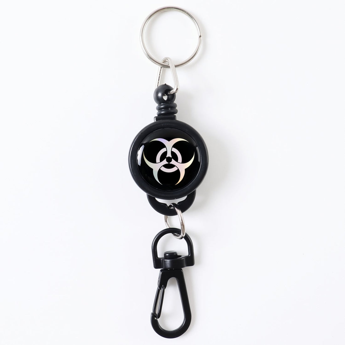 Durable retractable keychain securely clipped onto a fabric strap.