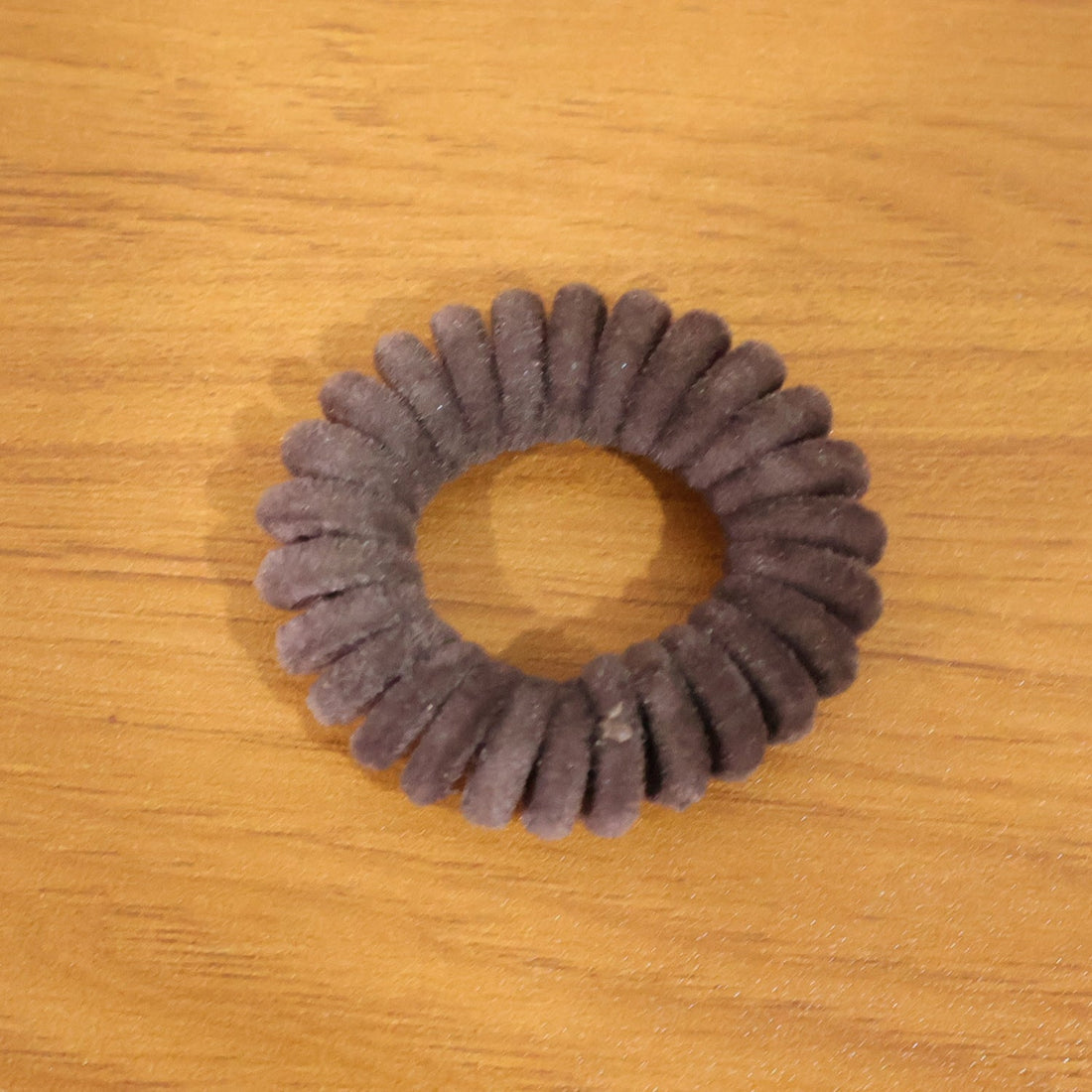Coiled waterproof telephone wire hair band in coil design